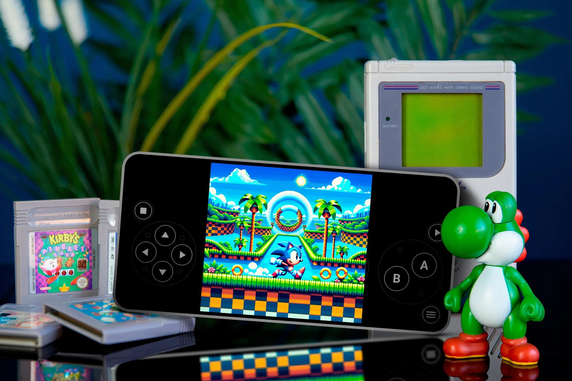 Điện thoại đang chạy game Sonic cổ điển trên trình giả lập, xung quanh là các băng game và mô hình nhân vật.