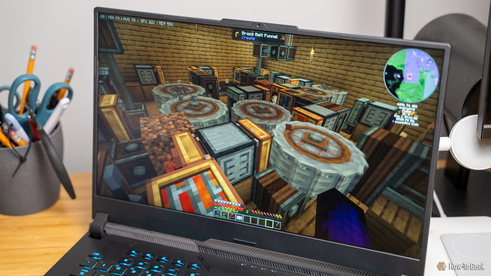 Hệ thống farm sắt tự động sử dụng Create Mod trong Minecraft hoạt động trên laptop.