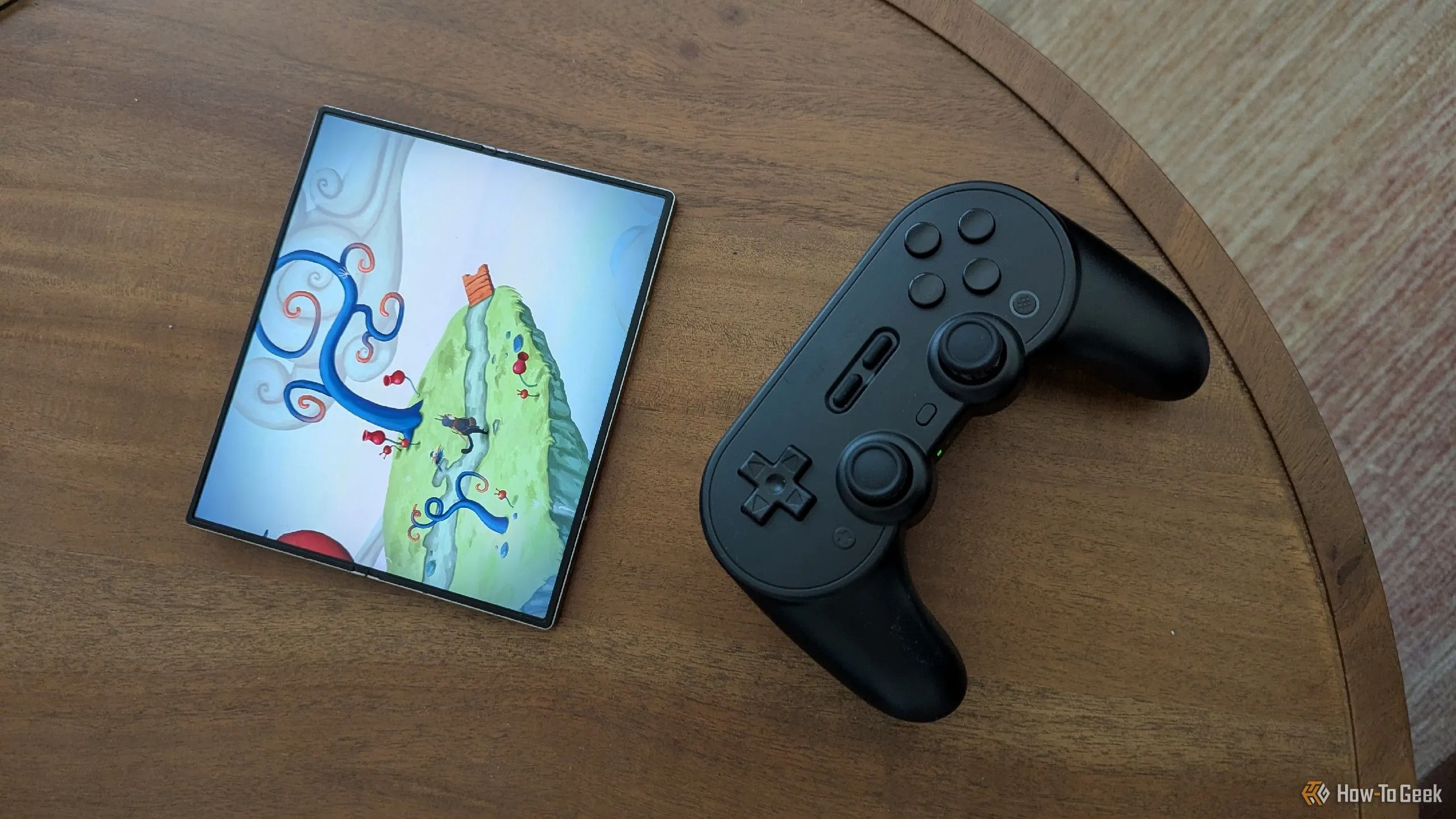 Hình ảnh minh họa game mobile trên điện thoại gập với tay cầm Bluetooth