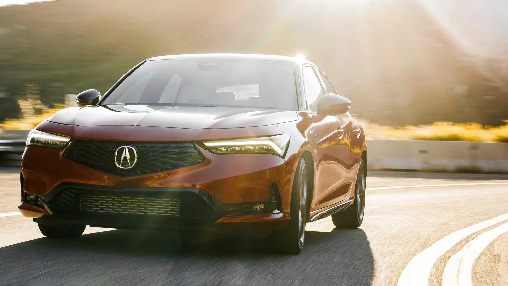 Acura Integra 2023 màu trắng ngoại thất góc 3/4 phía trước trên đường thành phố