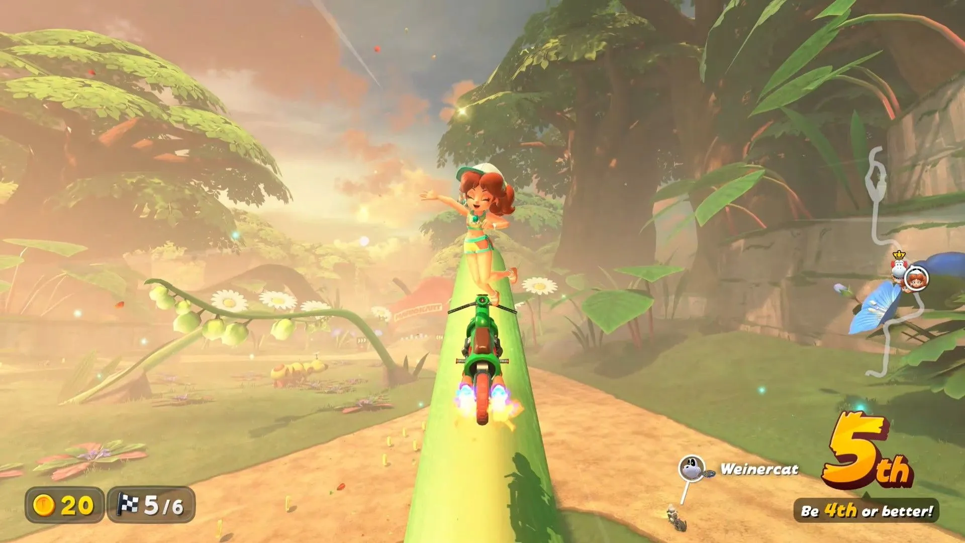 Daisy lướt trên một cây cỏ trong Mario Kart World