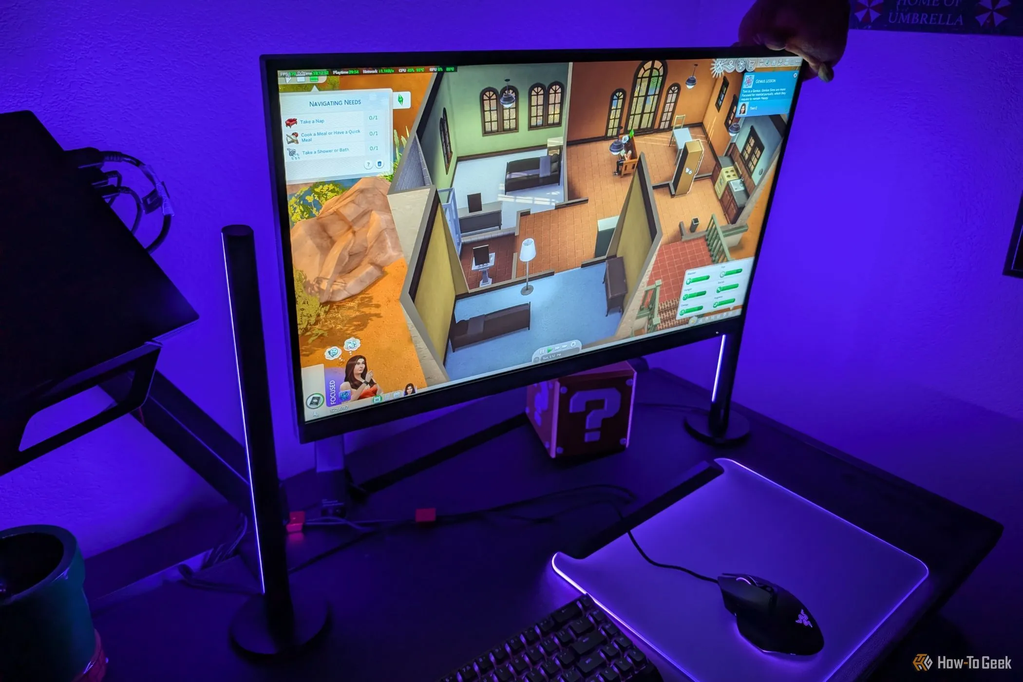 Đèn Razer Aether Light Bars phát sáng màu tím, minh họa khả năng phản ứng với tâm trạng &quot;tập trung&quot; của Sims trong game The Sims 4