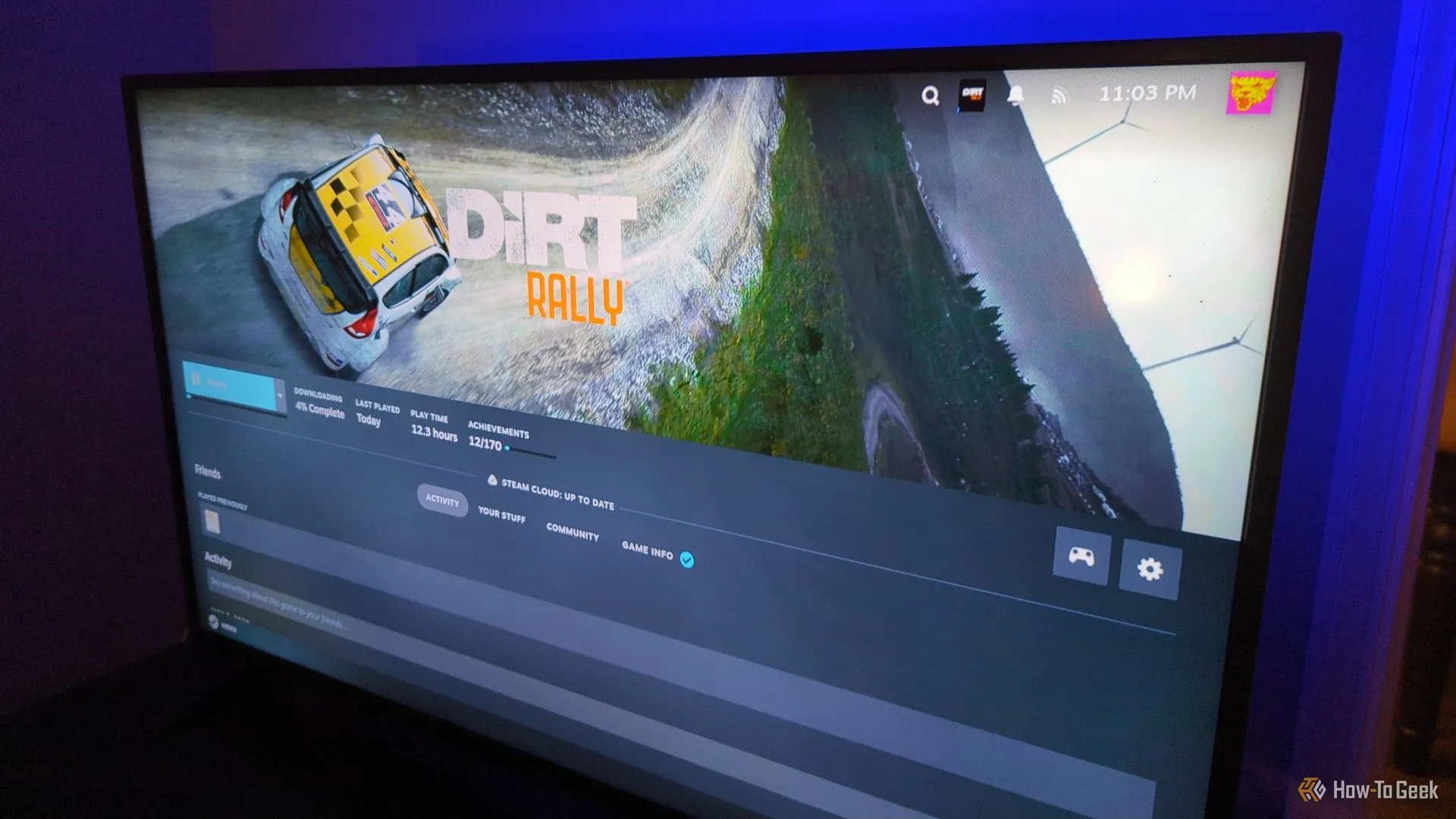 Màn hình TV hiển thị giao diện Steam Big Picture Mode đang cài đặt game Dirt Rally, thể hiện thành quả biến mini PC thành console chơi game.