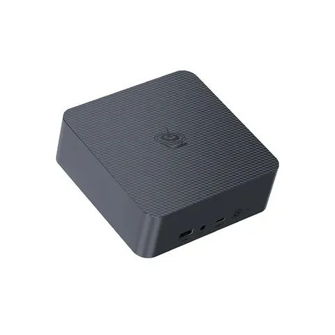 Mini PC Beelink EQi12 màu bạc, được đặt trên một bề mặt cùng với bàn phím và chuột không dây