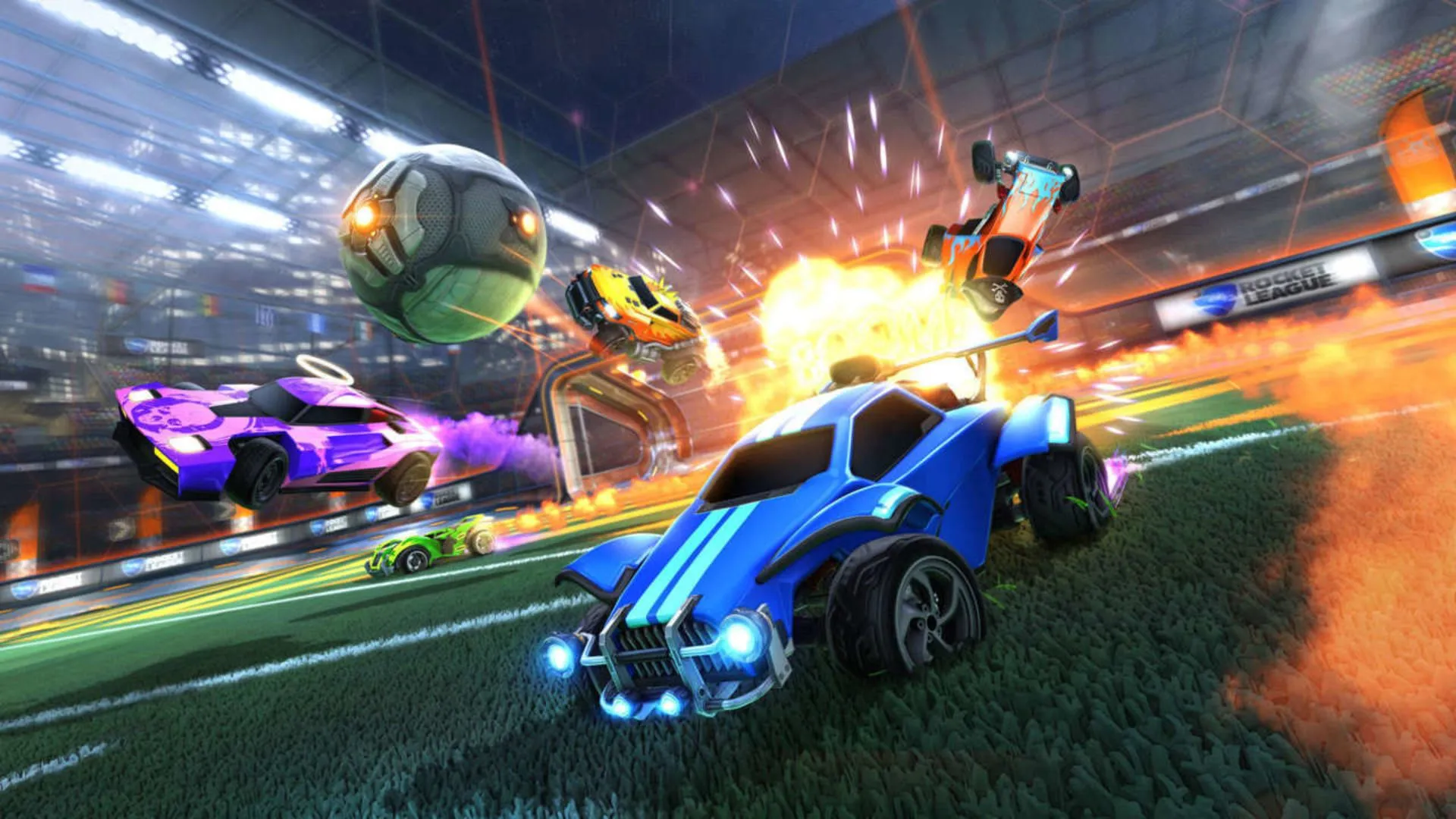 Một cảnh hỗn loạn với những chiếc xe và quả bóng bay lượn trên không trong game Rocket League, thể hiện sự kịch tính của trận đấu