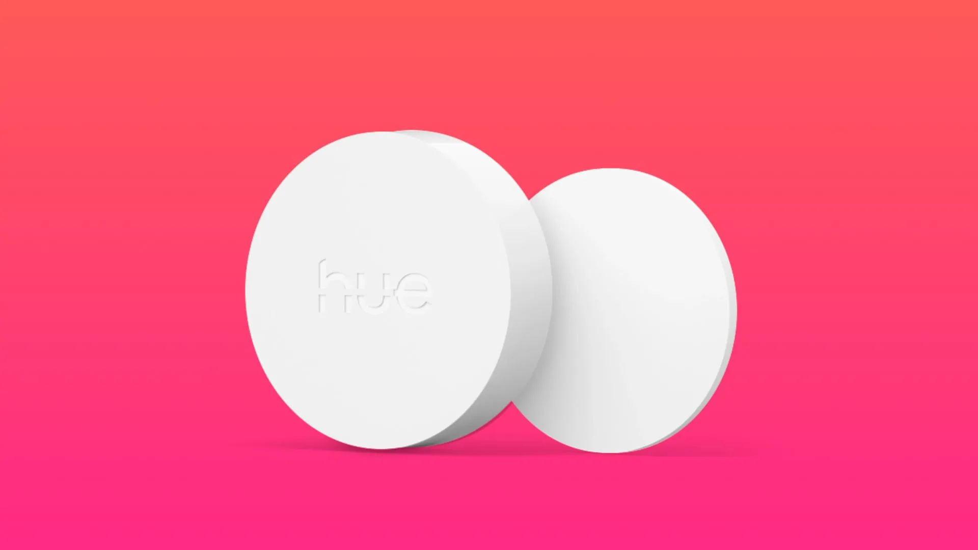 Nút bấm thông minh Hue Smart Button màu trắng đặt trên bề mặt phẳng