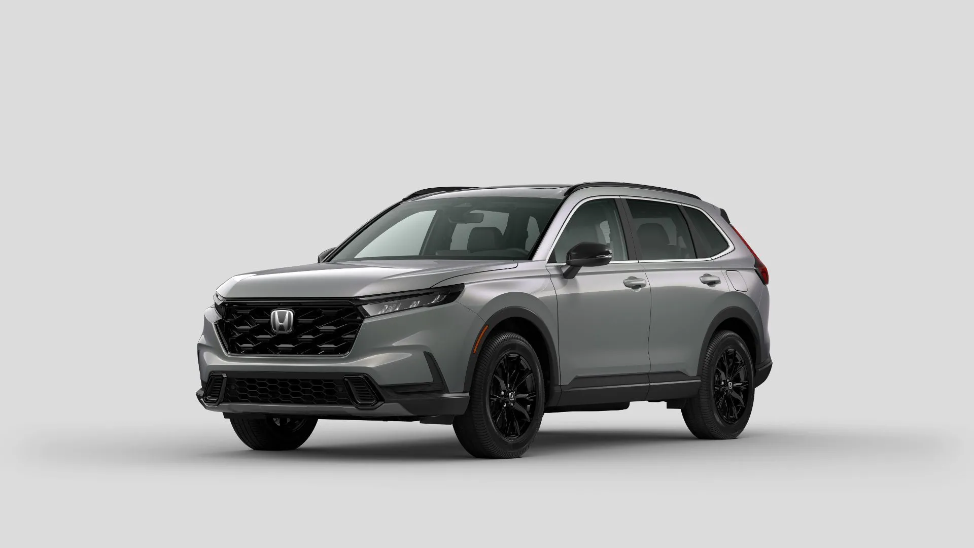 Toàn cảnh Honda CR-V Sport-L 2024 màu bạc nhìn từ góc phía trước, làm nổi bật thiết kế tổng thể của phiên bản trung cấp
