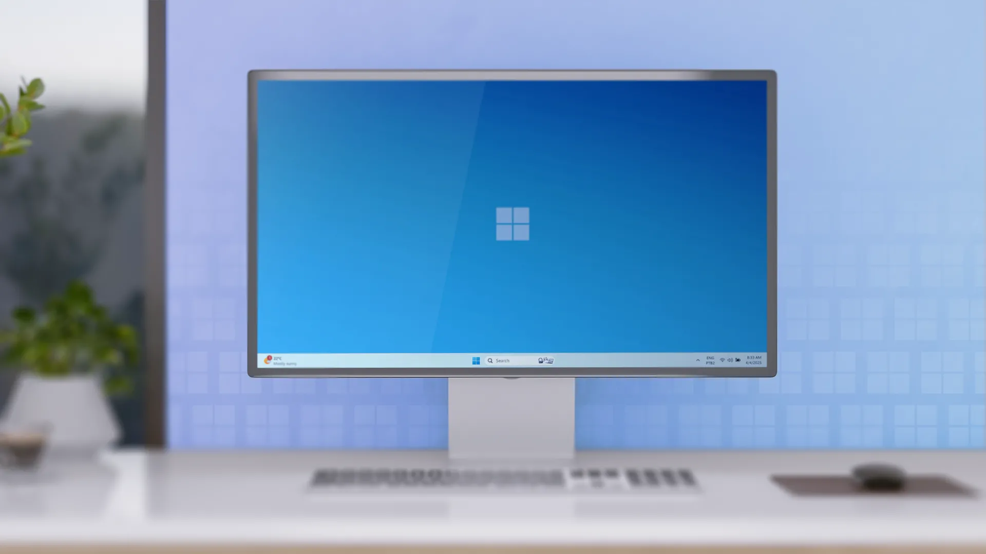Bàn làm việc tối giản với máy tính để bàn chạy Windows 11, thể hiện môi trường ứng dụng giao diện.